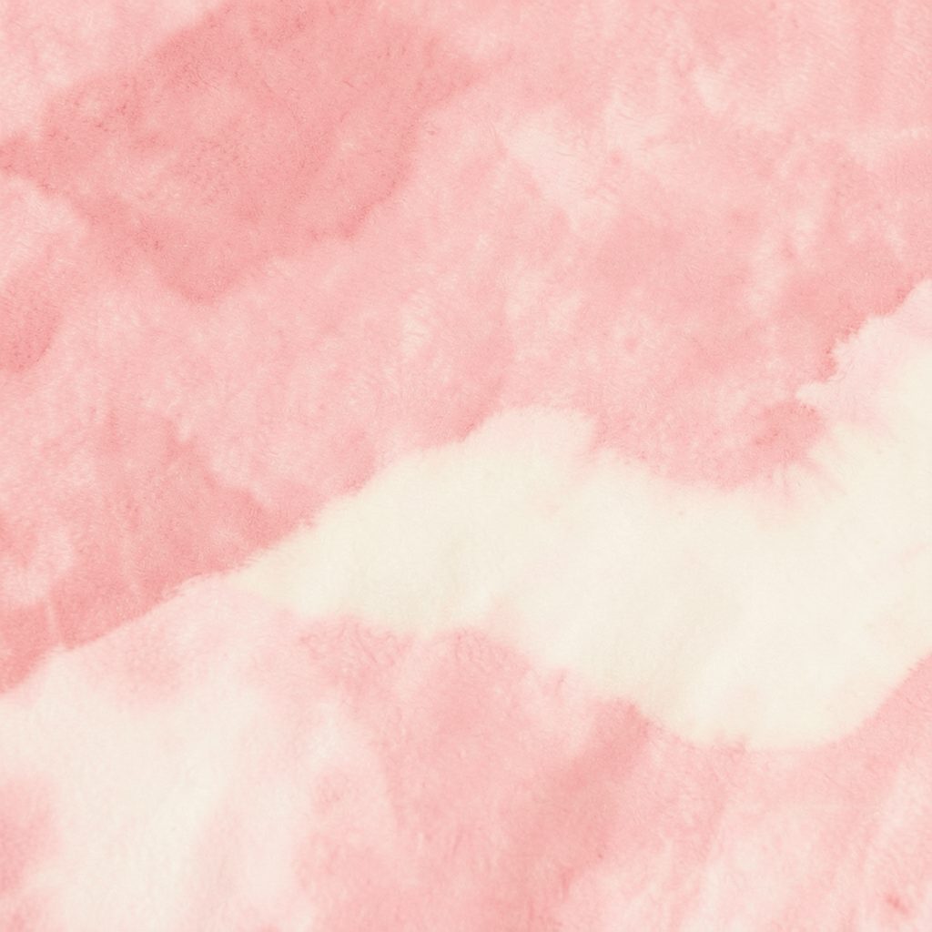 Soft abstract texture in blush pink and cream tones, evoking a fashion-editorial backdrop